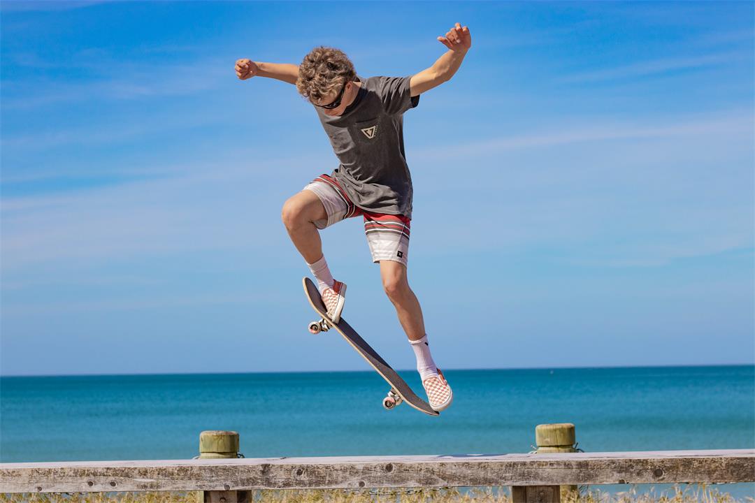 Skateboarder doing stunts photo .jpg