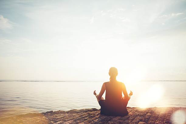 woman-doing-meditation-practice-on-the-beach.jpg